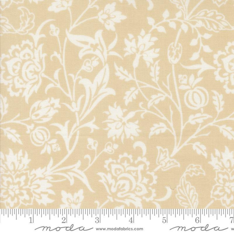 Floral patterned fabric in white on a beige background with a ruler for scale, featuring the Moda Fabrics brand.