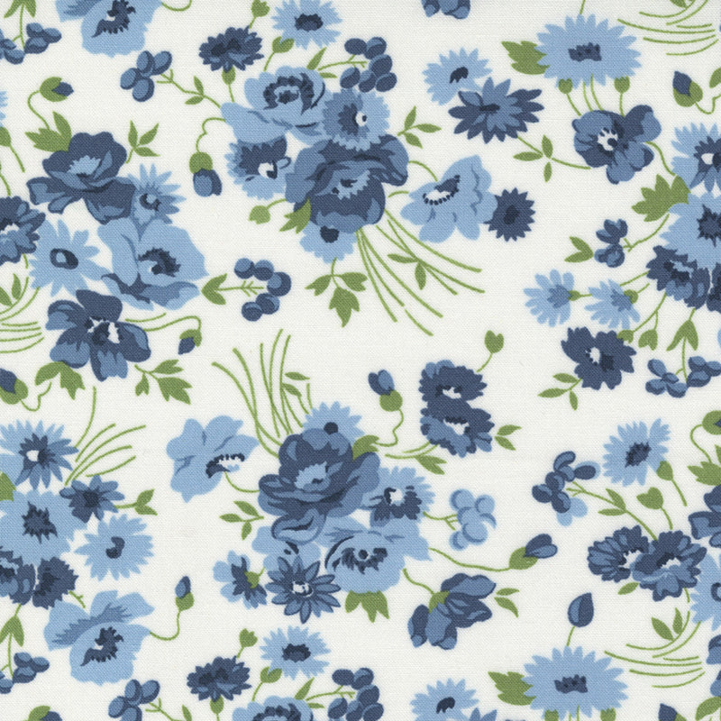 Blue and green floral print on a cream background wide quilt back fabric.