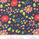 Wide Quilt Back Fabric with a colorful floral pattern on a navy background and a ruler for scale at the bottom.