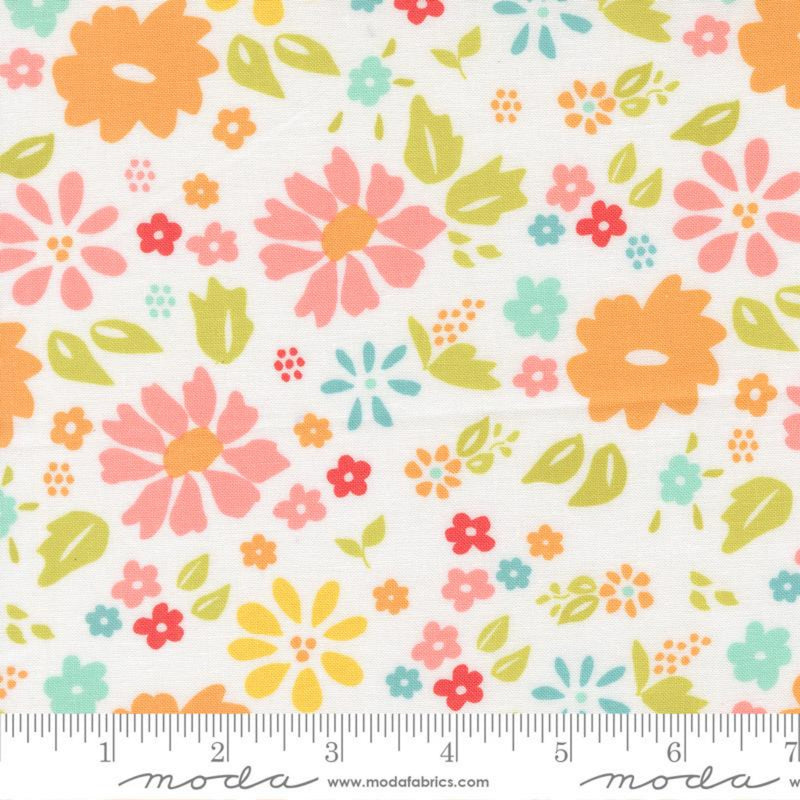 Wide Quilt Back Fabric with a colorful floral pattern on a white background and a ruler for scale at the bottom.