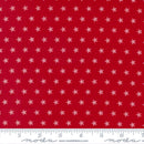 Red wide quilt backing fabric with a white star pattern and a ruler at the bottom to show scale.