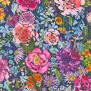 Wide quilt backing fabric with a colorful floral design in pink, purple, blue, orange and green flowers on a navy background.