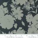 Wide quilt backing fabric with a floral print in gray on a black background. 