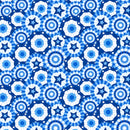 Wide quilt backing fabric with a pattern of blue and white stars and circles on a blue background.