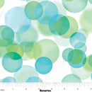 Wide quilt backing fabric pattern featuring overlapping translucent circles in shades of blue, green, and teal on a white background, with a measurement ruler at the bottom indicating scale.