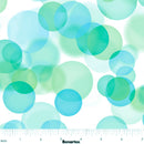 Wide quilt backing fabric pattern featuring overlapping translucent circles in shades of blue, green, and teal on a white background, with a measurement ruler at the bottom indicating scale.