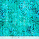 Wide quilt back fabric with a textured teal print with floral patterns with a ruler at the bottom to show scale.