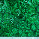 Green colored wide quilt backing fabric with a bohemian abstract design with a ruler at the bottom to show scale.
