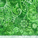 Ecru colored wide quilt backing fabric with a bohemian abstract design with a ruler at the bottom to show scale.