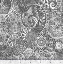 Gray wide quilt backing fabric with a bohemian abstract design with a ruler at the bottom to show scale.