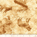 Wide quilt backing fabric with mountain animal silhouettes in tan and brown on a beige and tan background, featuring a ruler at the bottom to show scale.