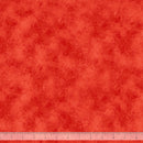 Red wide quilt backing fabric with a tone on tone texture print and a ruler at the bottom for scale.