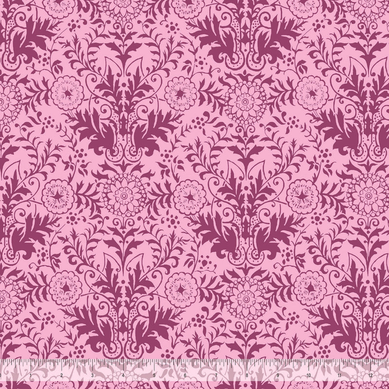 Wide quilt backing fabric with a pink floral damask pattern and a ruler at the bottom to show scale.