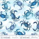 Wide quilt backing fabric with a pattern of blue crabs on a light blue background with a ruler at the bottom for scale.