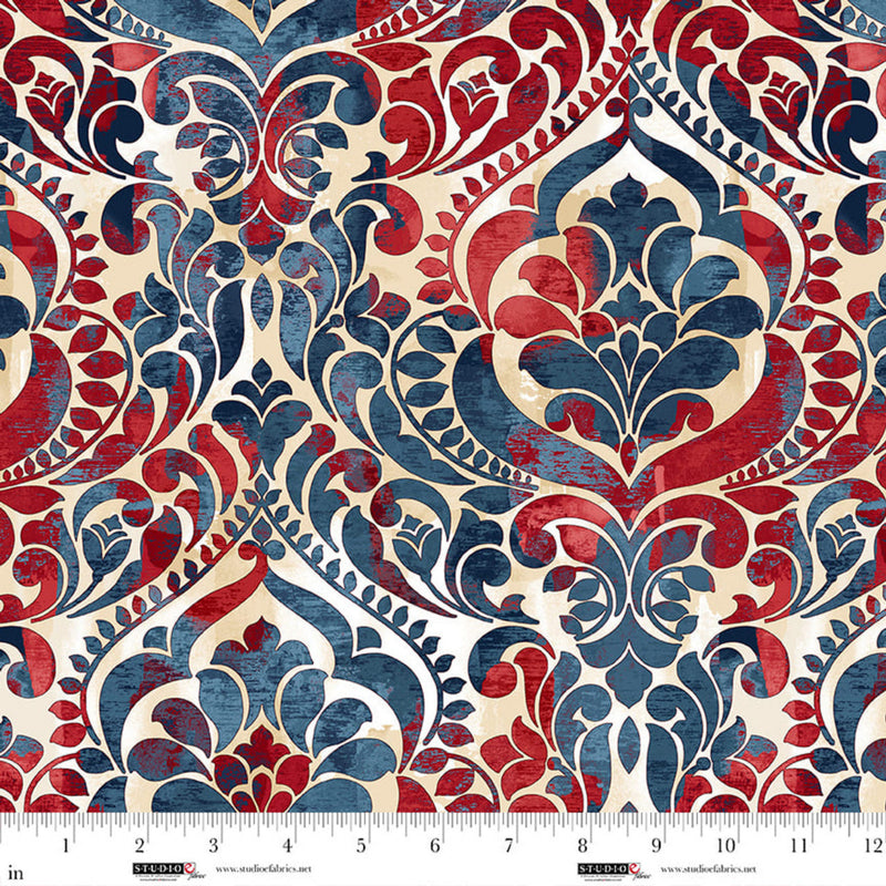 Wide quilt back fabric with a damask print in red, white, blue and beige colors.