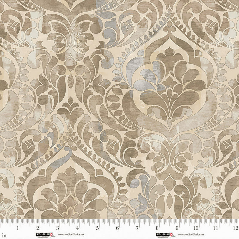 Wide quilt back fabric with a damask print in tan, gray, and taupe on a beige background.