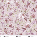 Floral patterned wide quilt backing fabric  with mauve, pink, purple and white flowers on a dusty pink and gray background with a ruler at the bottom to show scale.