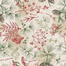 Wide quilt backing fabric with berry sprigs, leaves, and pine branches with pine cones in green and red scattered on  a beige and tan background.