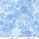 A close-up of a light blue wide quilt backing fabric with a repeating pattern of white and blue watercolor-style snowflakes and small botanical motifs. A white measurement ruler is visible along the bottom edge.