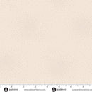 Wide quilt backing fabric with tiny dots in a circular pattern on a sand colored background with a ruler for scale.