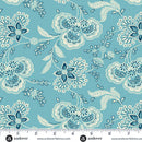Floral paisley pattern on a blue background with a ruler at the bottom to show scale.