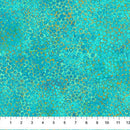 Wide quilt backing fabric with a multicolored, tiny circle pattern with turquoise, aqua, blue, green, and yellow hues with a ruler at the bottom for scale.