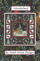 Quilt pattern with deer and nature elements on a dark background, labeled 'Wonderland by Coach House Designs'.