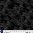 Back wide quilt backing fabric with a  tone on tone textured look with a ruler at the bottom to show scale.