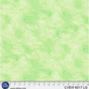 Light green wide quilt backing fabric with a  tone on tone textured look with a ruler at the bottom to show scale.