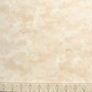 Beige wide quilt backing fabric in a mottled tone on tone print with a ruler at the bottom to show scale.