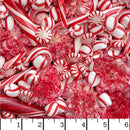 Wide quilt backing fabric with a dense pile of red and white holiday candies, including candy canes, peppermint sticks, round peppermint candies, and pinkish-red flower-shaped sweets, filling the entire frame. with a small ruler at the bottom for scale.