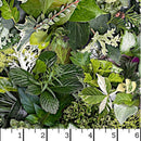 Wide quilt backing fabric with various green foliage and leaves, including textured, variegated, and delicate plant species with a white ruler scale at the bottom indicating measurement.