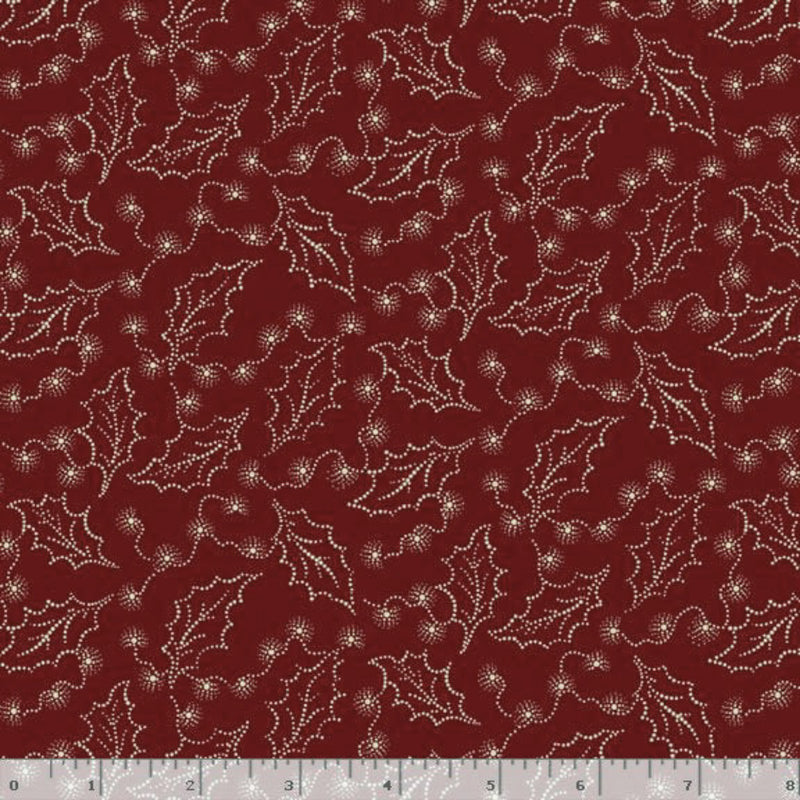 Dark brick red fabric with white holly leaf pattern, measured against a ruler for scale.
