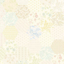 Wide quilt backing fabric with a repeating pastel hexagon print with floral, paisley, and geometric motifs in soft yellow, blue, pink, green and beige on a cream background.