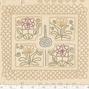 Wide quilt backing fabric with printed designs that looks like crewelwork embroidery with a ruler at the bottom for scale.