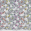 Wide quilt backing fabric with colorful leaf pattern on a gray background with a ruler at the bottom to show scale.