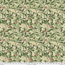 Wide quilt backing fabric with a repeating botanical pattern of green leaves, brown branches, cream-colored berries, and small red berries on a tan background, with a measuring ruler visible along the bottom edge.