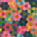 Wide quilt backing fabric with a colorful hexagonal pattern with various shapes and colors.