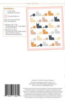 Back cover of a sewing pattern booklet titled 'Under My Skein' showing materials, a sample pattern layout, a barcode, and copyright details.
