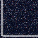 Wide quilt backing fabric with tiny scattered stars in red, white, blues, and tan on a dark navy background with a ruler on two sides to show scale.