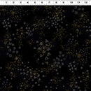 Black wide quilt backing fabric with a repeating pattern of small gold dots, stars, and gray geometric shapes, shown with a white ruler at the top for scale.